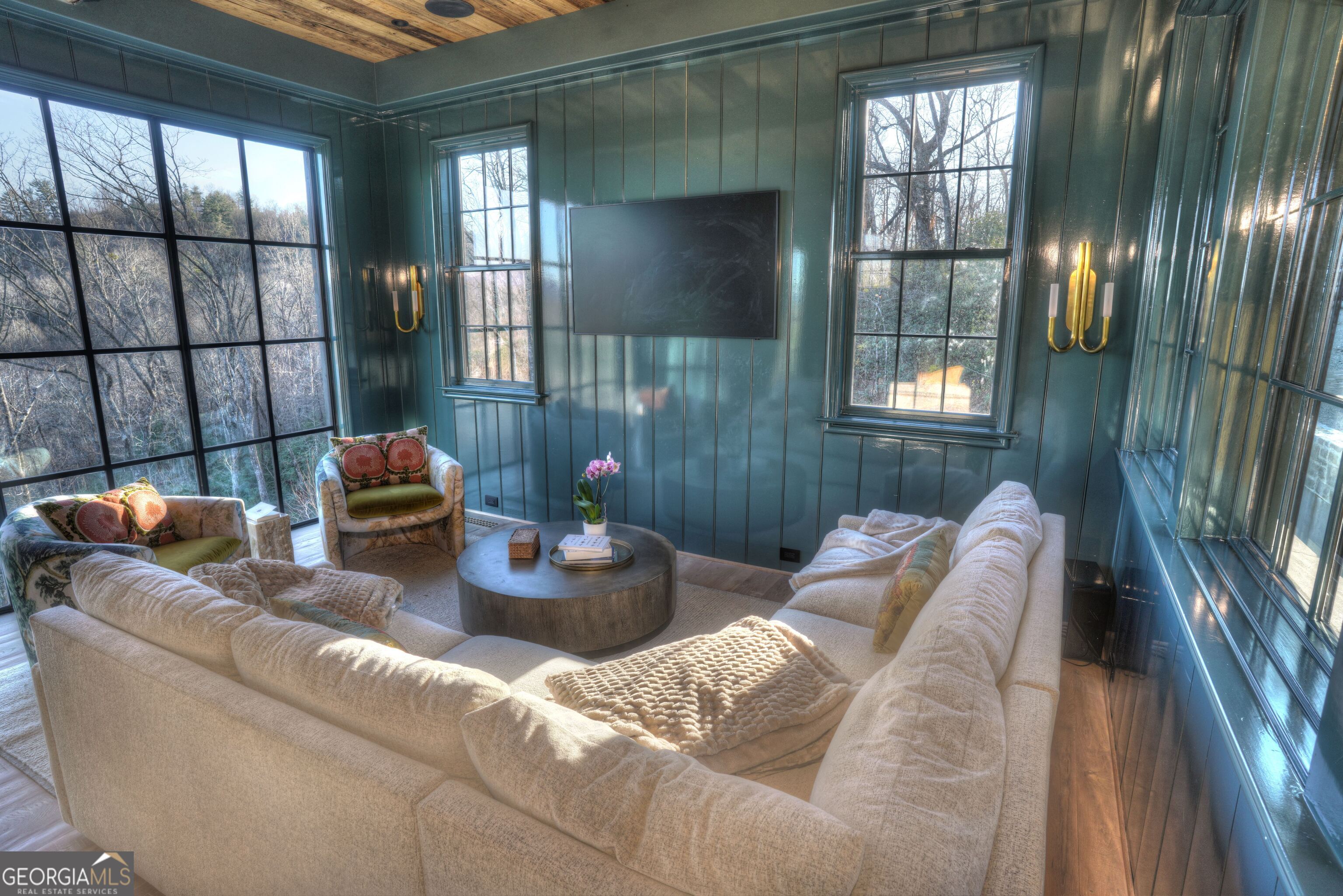 814 Summit Ridge Drive Clarkesville, GA 30523 - Photo 17 of 85 a living room with furniture and a floor to ceiling window