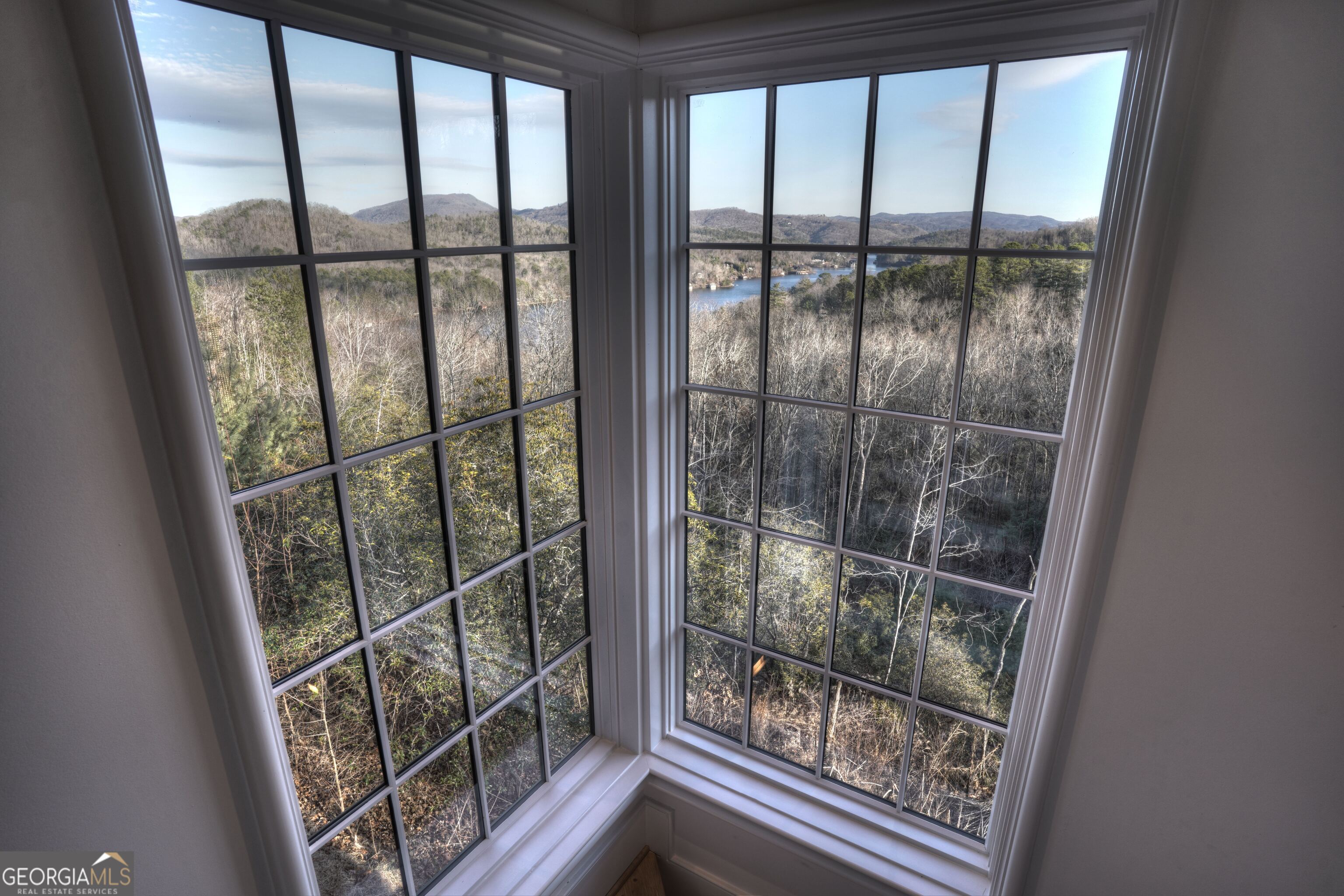 814 Summit Ridge Drive Clarkesville, GA 30523 - Photo 45 of 85 a view of a room with wooden floor and windows