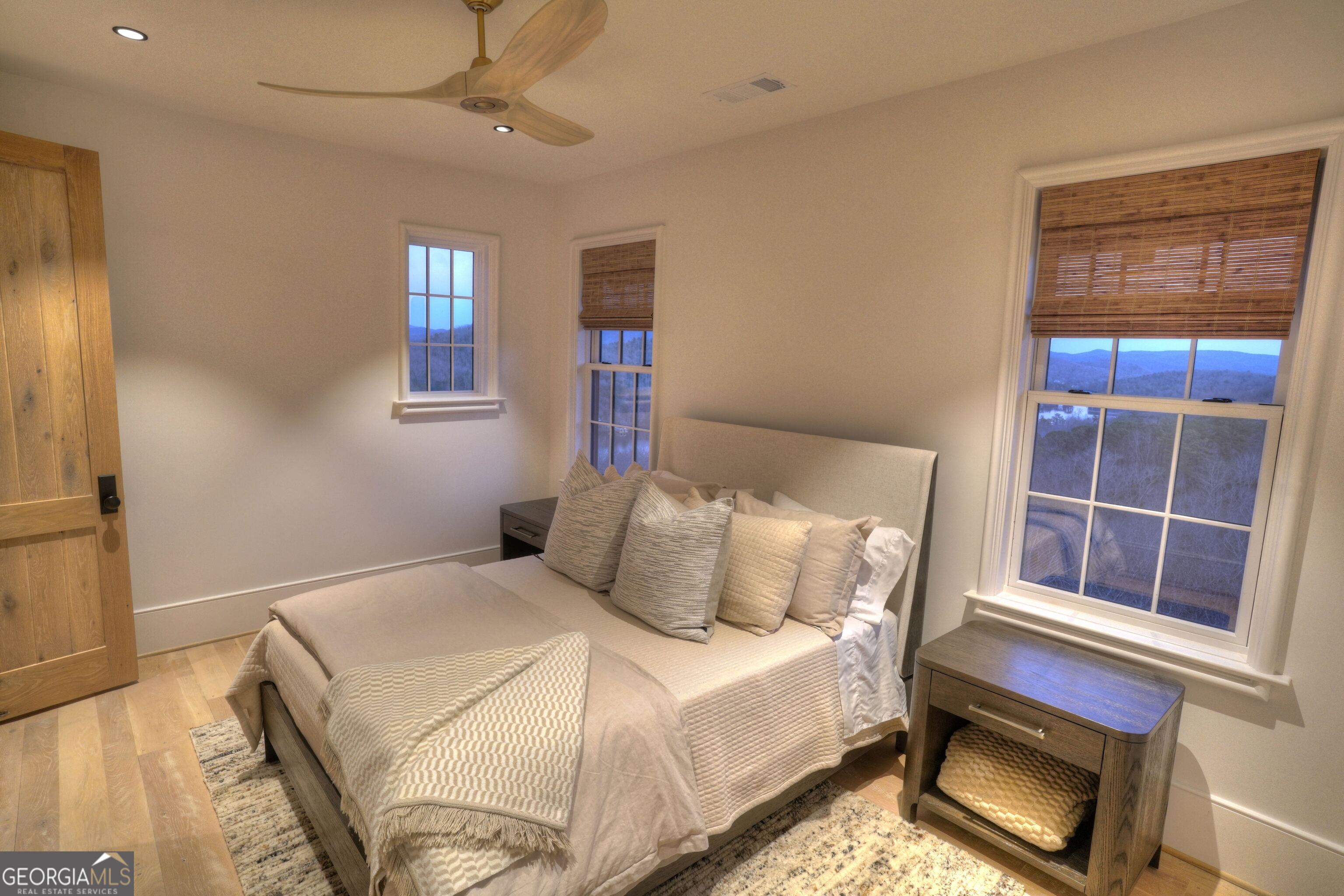 814 Summit Ridge Drive Clarkesville, GA 30523 - Photo 54 of 85 a bedroom with a bed and a window