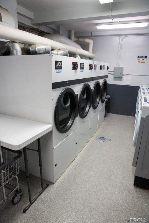 34-10 75th Street, Unit K2 Queens, NY 11372 - Photo 13 of 16 a utility room with dryer and washer