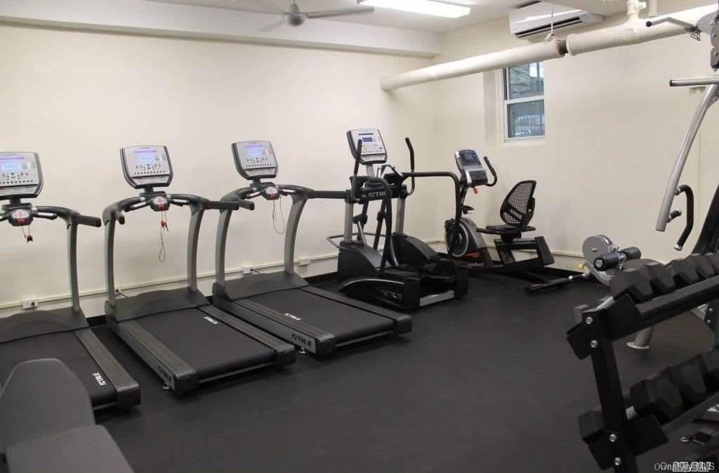 34-10 75th Street, Unit K2 Queens, NY 11372 - Photo 16 of 16 a room with gym equipment