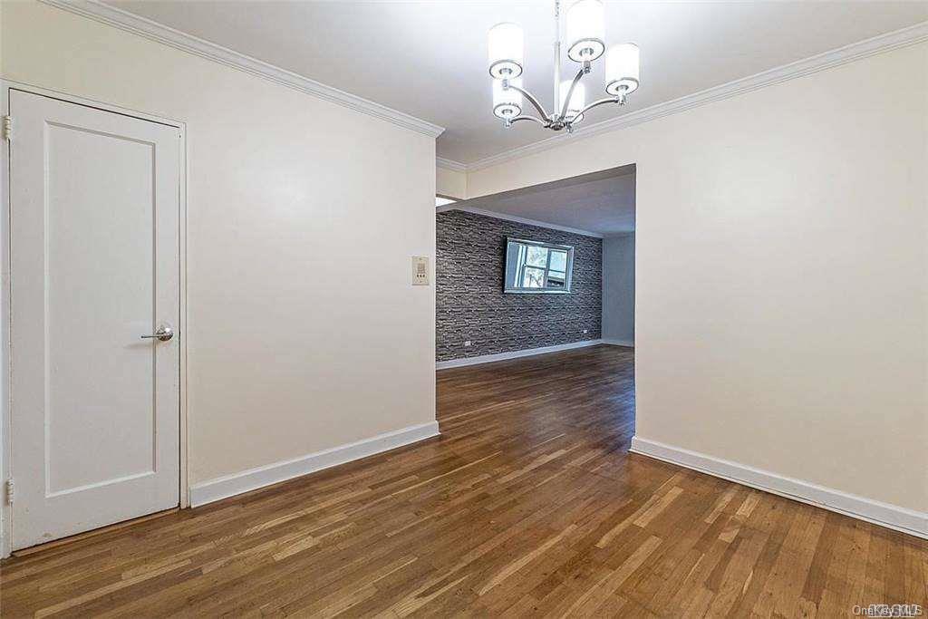 34-10 75th Street, Unit K2 Queens, NY 11372 - Photo 2 of 16 a view of empty room with wooden floor