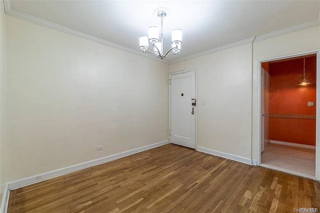 34-10 75th Street, Unit K2 Queens, NY 11372 - Photo 3 of 16 wooden floor in an empty room