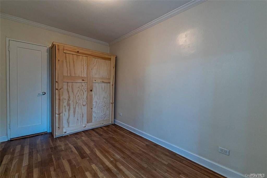 34-10 75th Street, Unit K2 Queens, NY 11372 - Photo 8 of 16 a view of small space with wooden floor