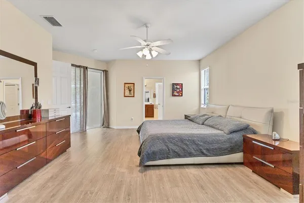 a bedroom with a bed and a dresser