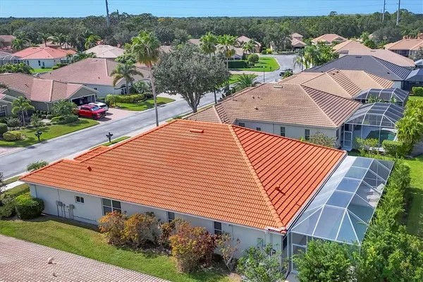 an aerial view of residential houses with outdoor space