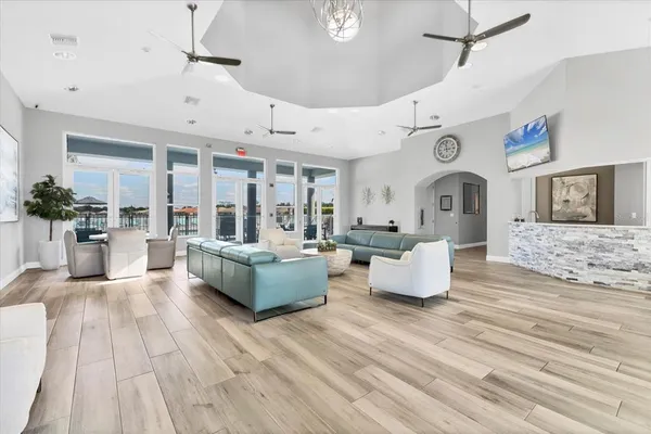 a dining room with furniture and a floor to ceiling window