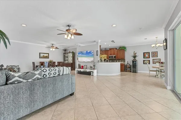a living room with furniture and kitchen view