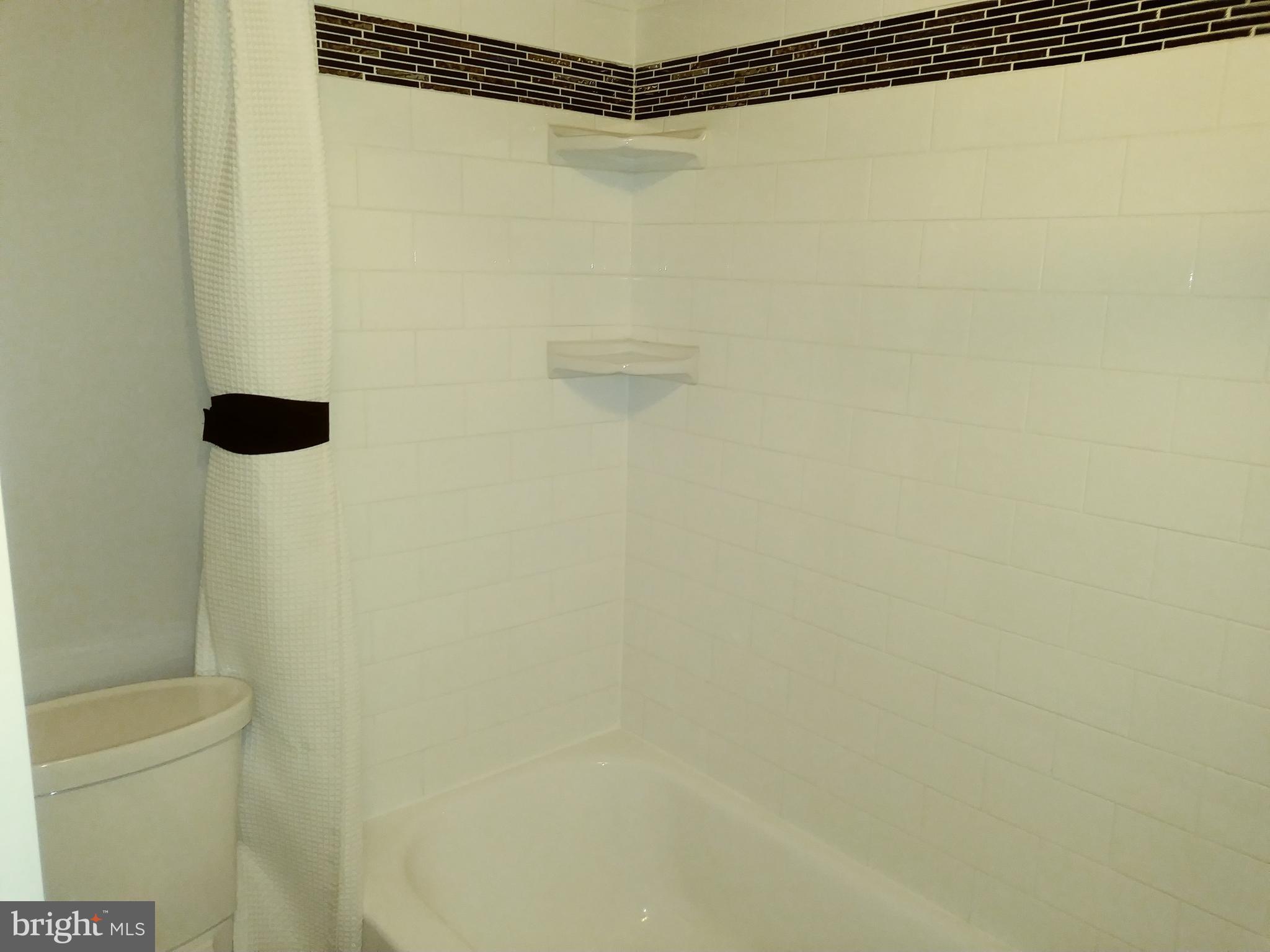 1010 Race Street, Unit 8M Philadelphia, PA 19107 - Photo 12 of 13 a bathroom with a shower