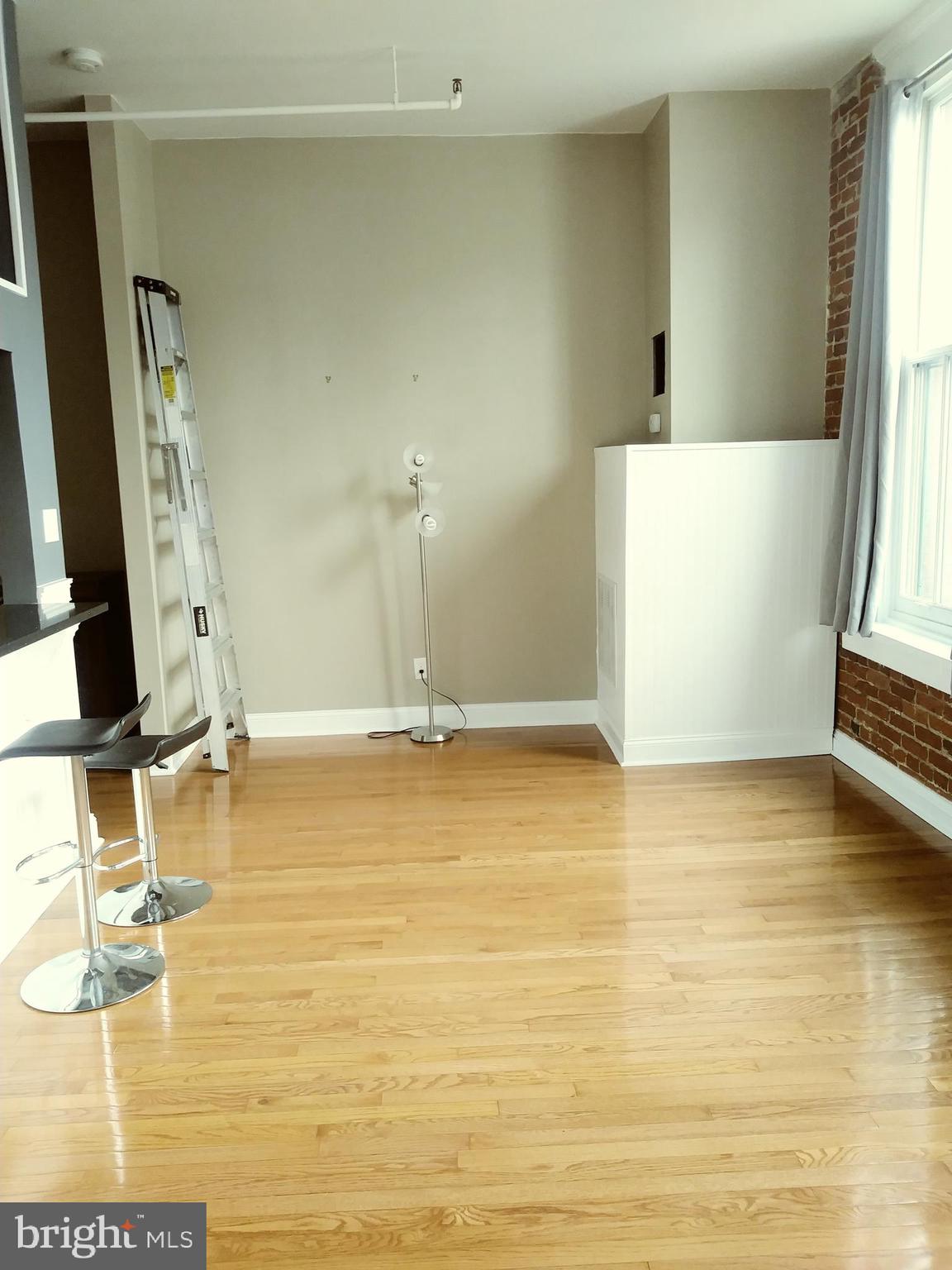 1010 Race Street, Unit 8M Philadelphia, PA 19107 - Photo 3 of 13 a view of a room with gym equipment