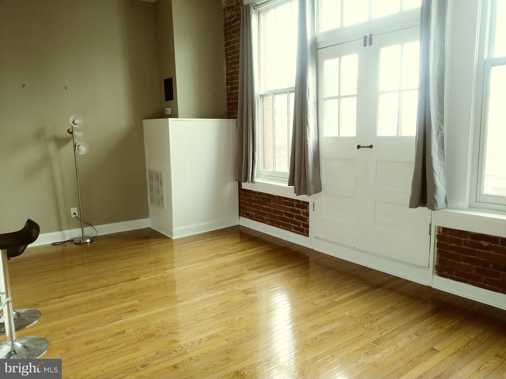 1010 Race Street, Unit 8M Philadelphia, PA 19107 - Photo 4 of 13 a view of an empty room with a window
