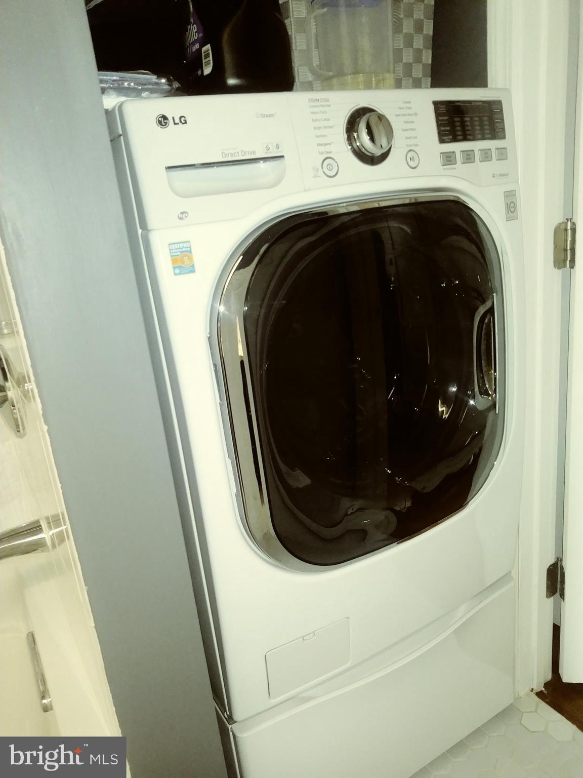 1010 Race Street, Unit 8M Philadelphia, PA 19107 - Photo 10 of 13 a close up view of a washer and dryer