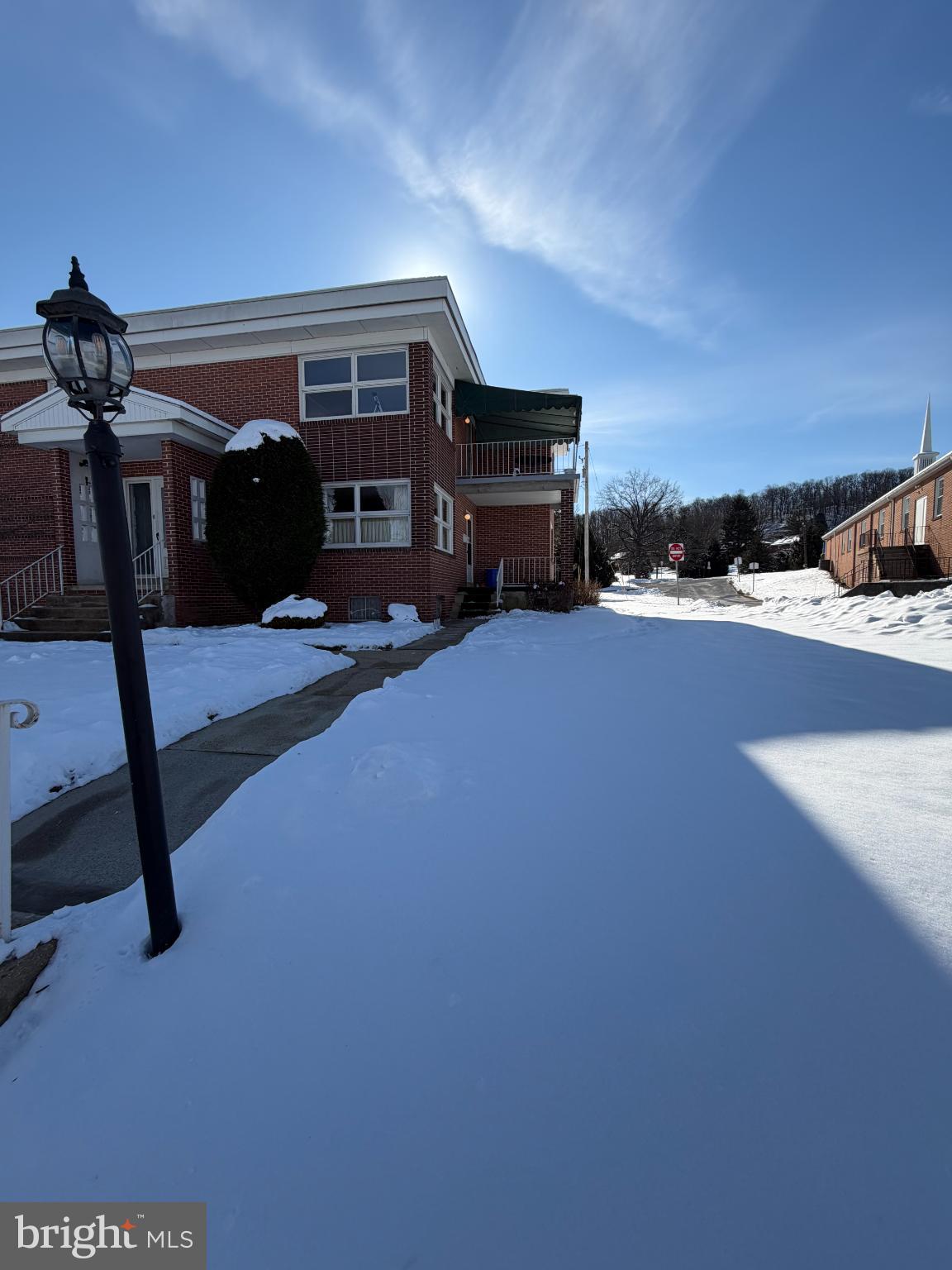 a view of a livingroom with furniture and a floor to ceiling window