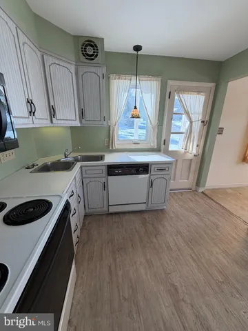 a bathroom with a sink toilet and mirror