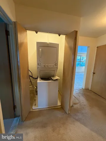 a view of empty room with wooden walls