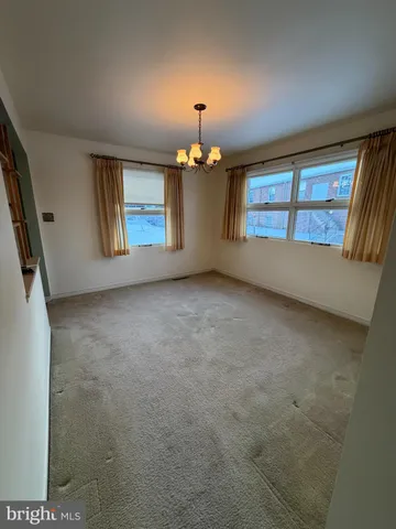 a kitchen with a sink a stove and cabinets