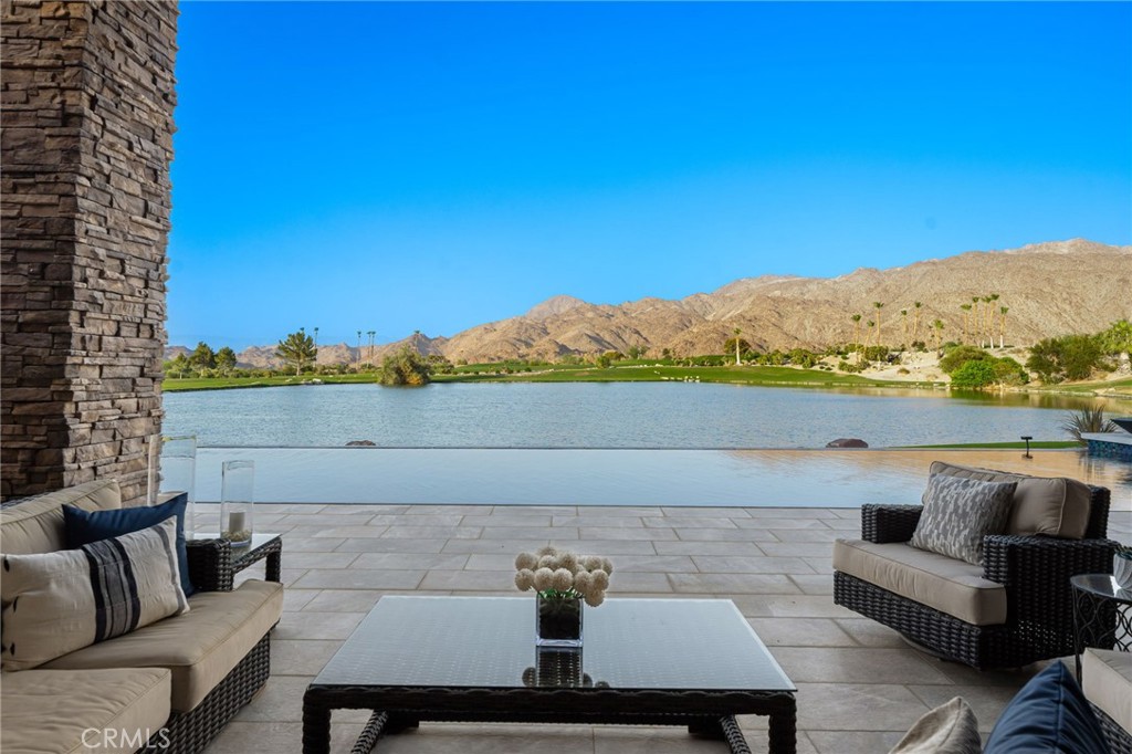49967 Ridge View Way Palm Desert, CA 92260 - Photo 15 of 68 Infinity edge pool seemingly spilling to the lake. All golf course and mountain views after that, with not a roof in sight.