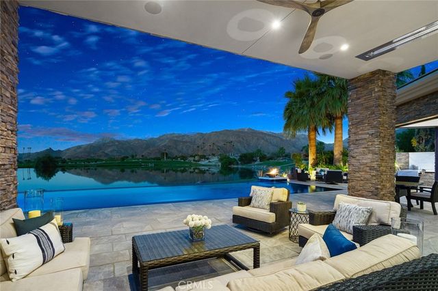 a view of sitting area with furniture and lake view