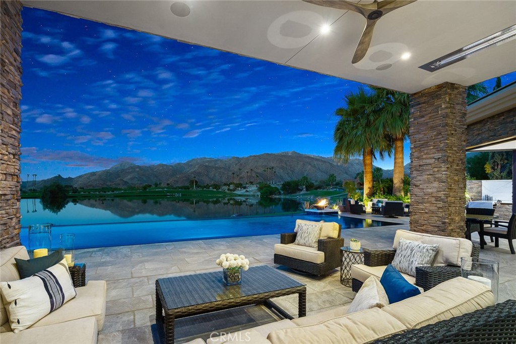 49967 Ridge View Way Palm Desert, CA 92260 - Photo 2 of 68 a view of sitting area with furniture and lake view