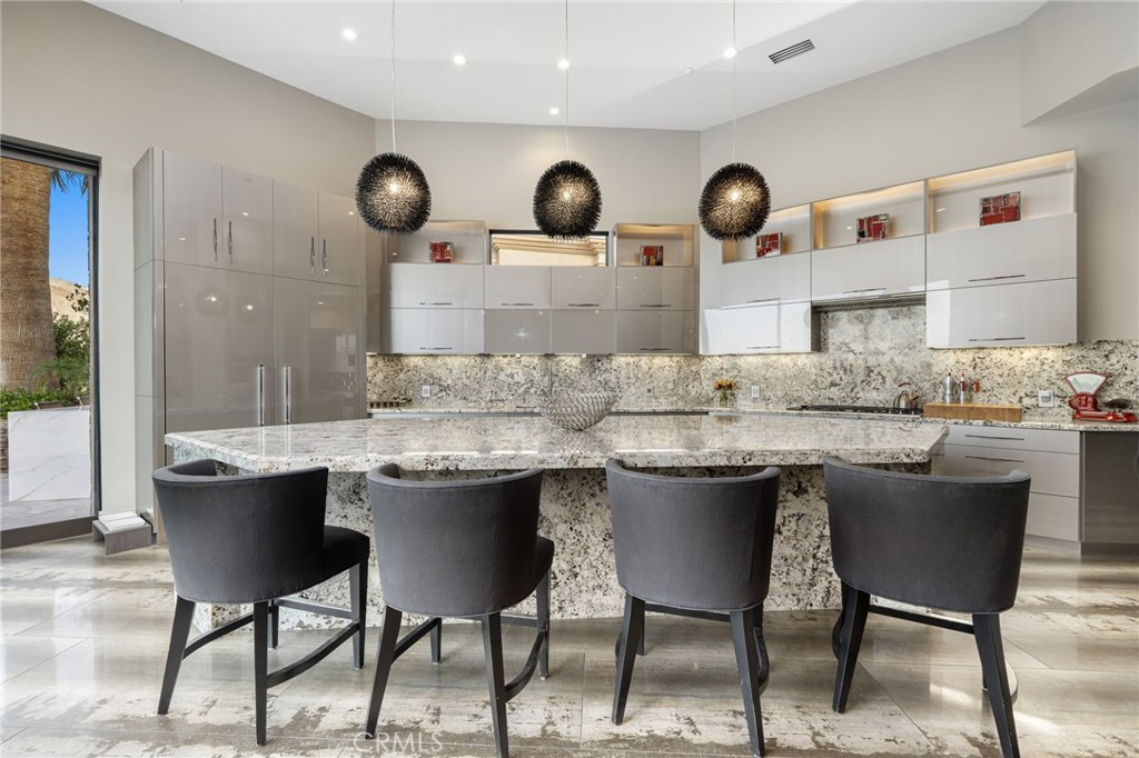 49967 Ridge View Way Palm Desert, CA 92260 - Photo 21 of 68 a kitchen with a table and chairs in it