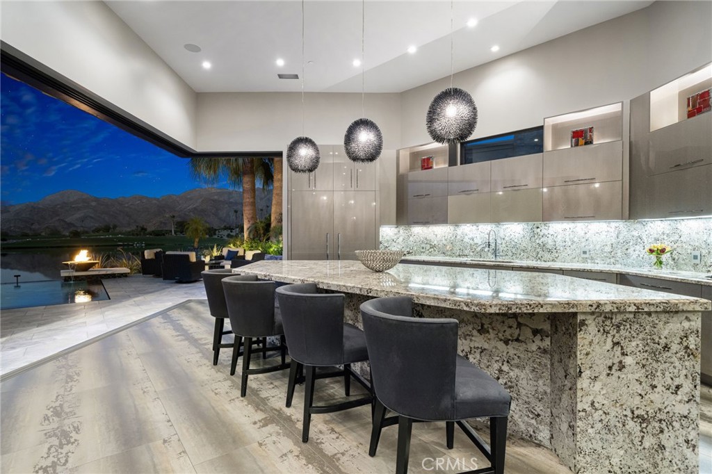 49967 Ridge View Way Palm Desert, CA 92260 - Photo 26 of 68 a kitchen with a table and chairs in it