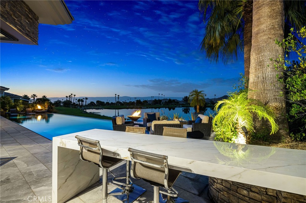 49967 Ridge View Way Palm Desert, CA 92260 - Photo 27 of 68 a view of a terrace with furniture and a potted plant