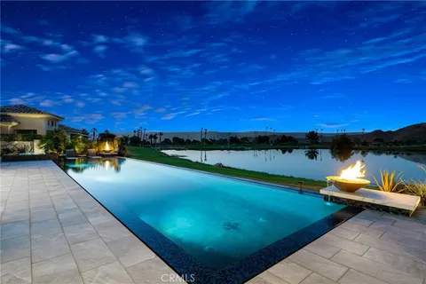 a view of a swimming pool with lounge chair