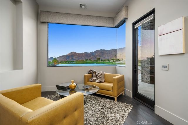 a spacious bathroom with a double vanity sink and a mirror