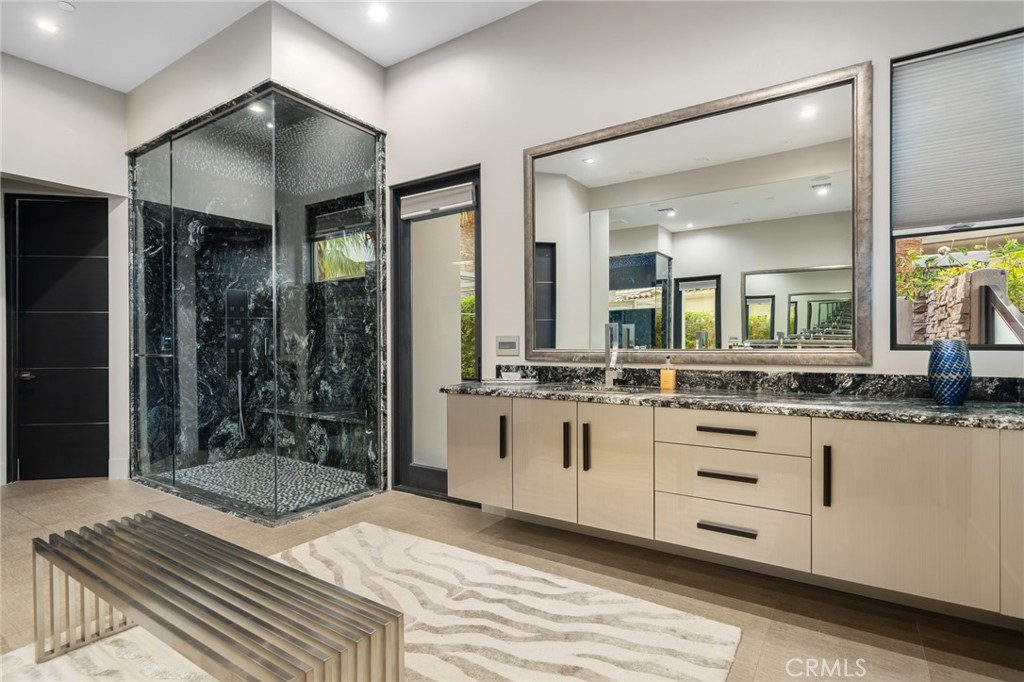 49967 Ridge View Way Palm Desert, CA 92260 - Photo 38 of 68 Primary bath with spa level shower with waterfall, and hydro jet therapy.