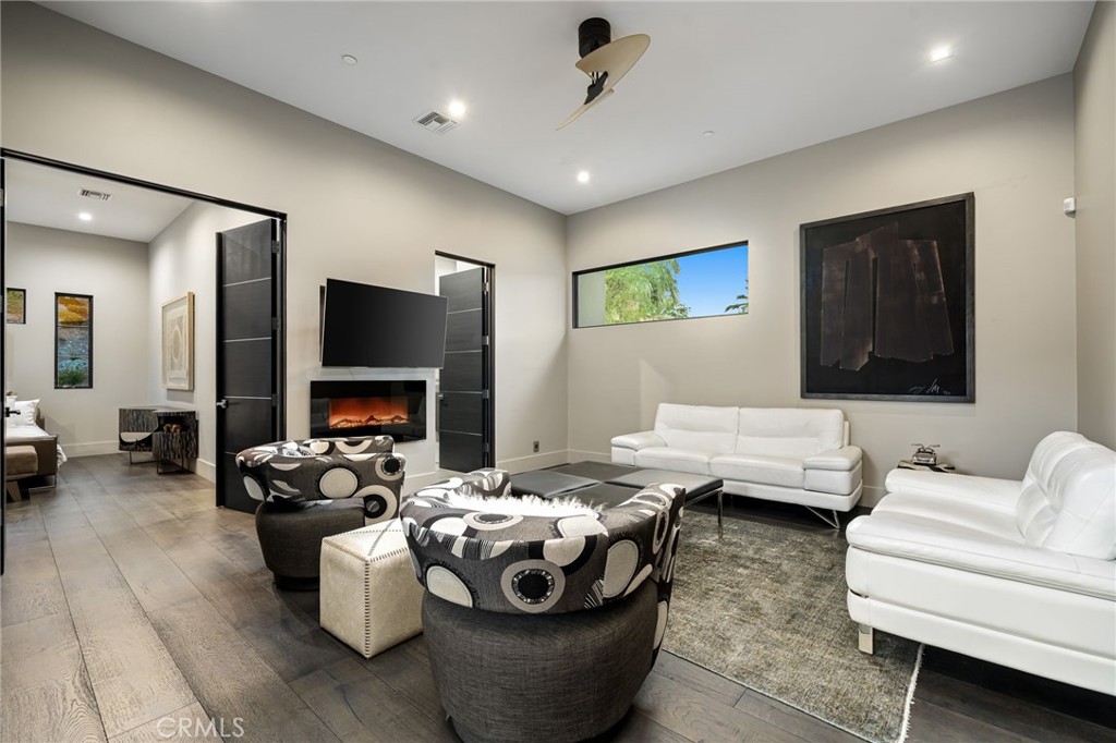 49967 Ridge View Way Palm Desert, CA 92260 - Photo 43 of 68 a living room with furniture and a flat screen tv