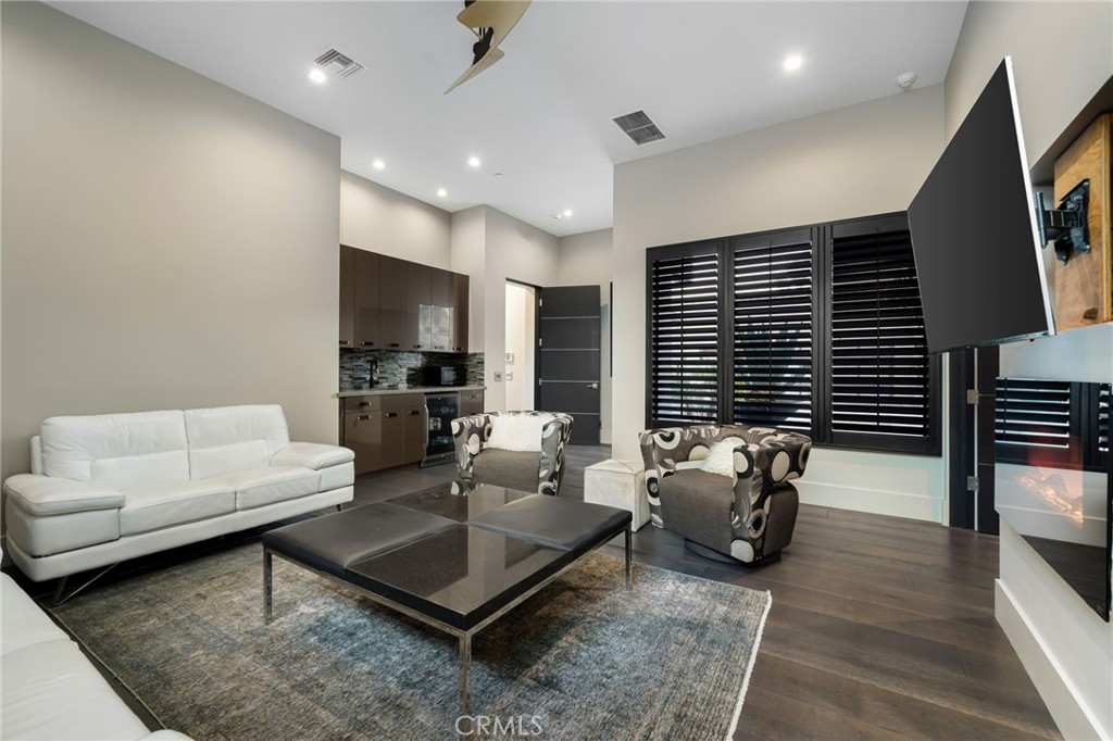49967 Ridge View Way Palm Desert, CA 92260 - Photo 44 of 68 a living room with furniture and a flat screen tv