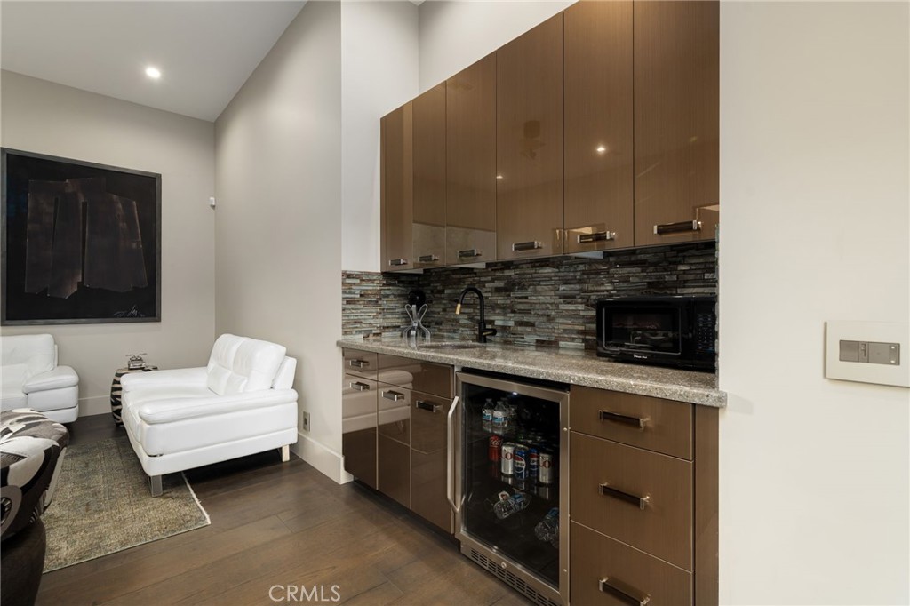 49967 Ridge View Way Palm Desert, CA 92260 - Photo 45 of 68 a kitchen with a sink dishwasher a stove and a microwave oven