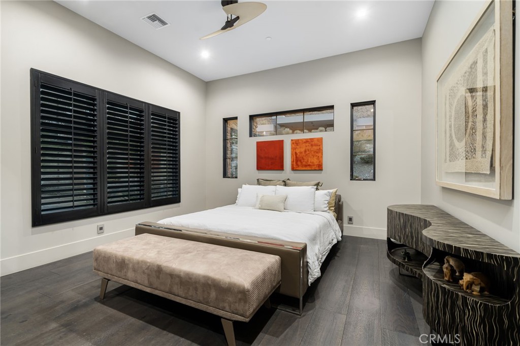 49967 Ridge View Way Palm Desert, CA 92260 - Photo 46 of 68 a bedroom with bed and wooden floor