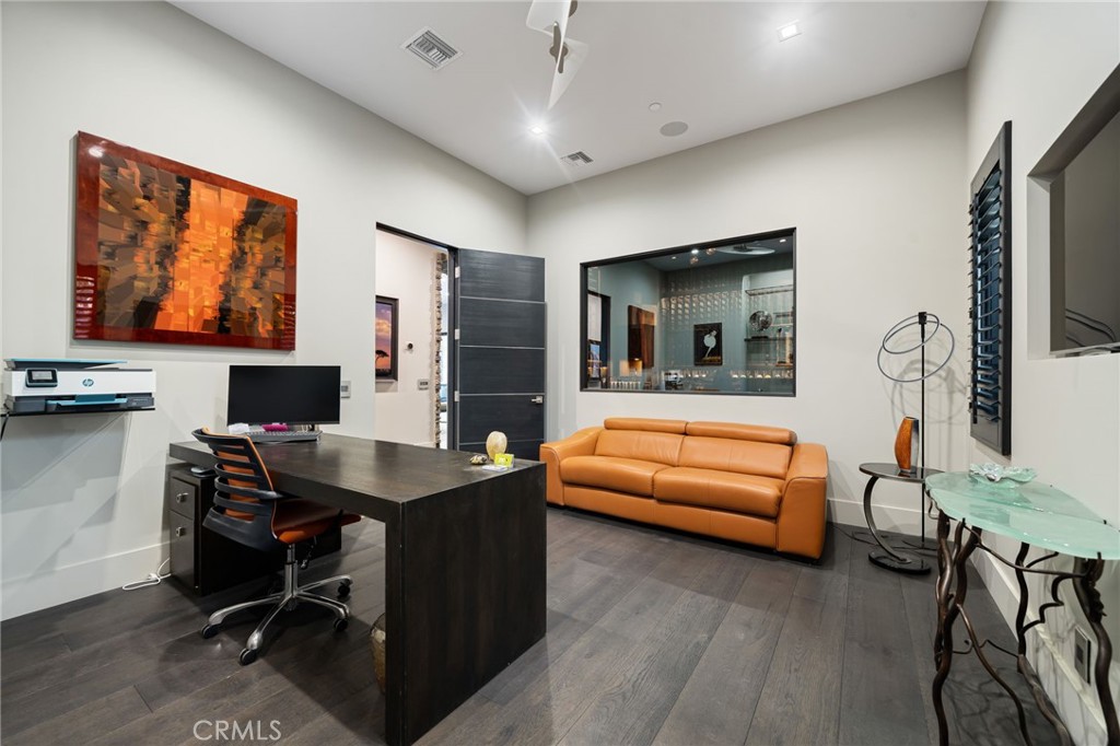 49967 Ridge View Way Palm Desert, CA 92260 - Photo 48 of 68 a work room with furniture and a flat screen tv