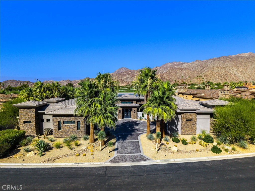 49967 Ridge View Way Palm Desert, CA 92260 - Photo 5 of 68 front view of house with a yard