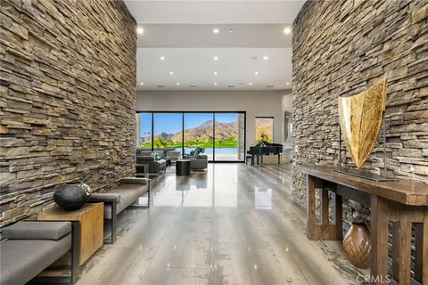a living room with furniture fireplace and flat screen tv