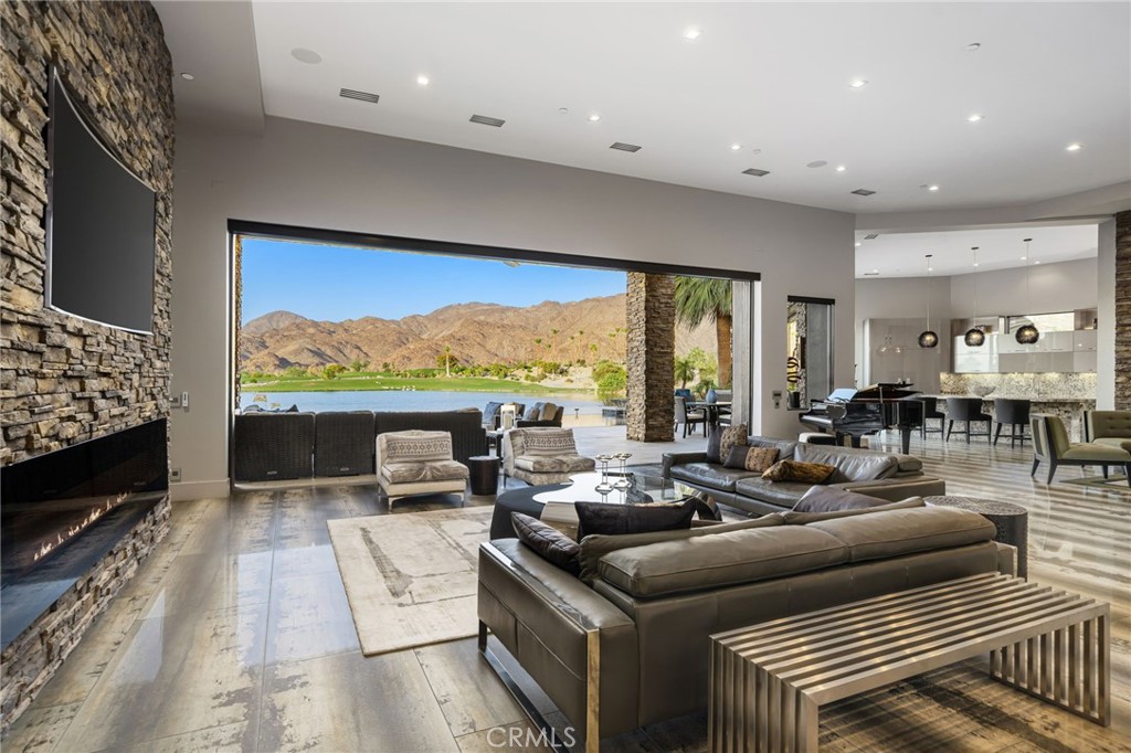 49967 Ridge View Way Palm Desert, CA 92260 - Photo 68 of 68 a living room with furniture and a flat screen tv