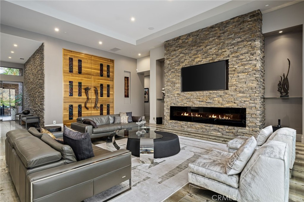 49967 Ridge View Way Palm Desert, CA 92260 - Photo 9 of 68 a living room with furniture fireplace and flat screen tv