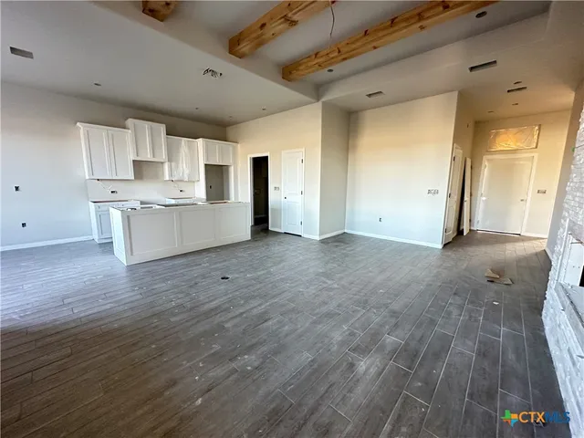 a view of a kitchen with microwave and stove