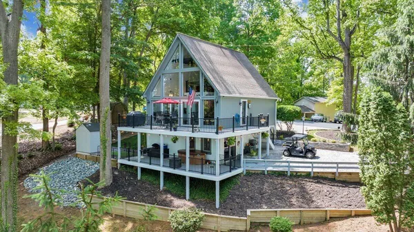 a view of house with backyard