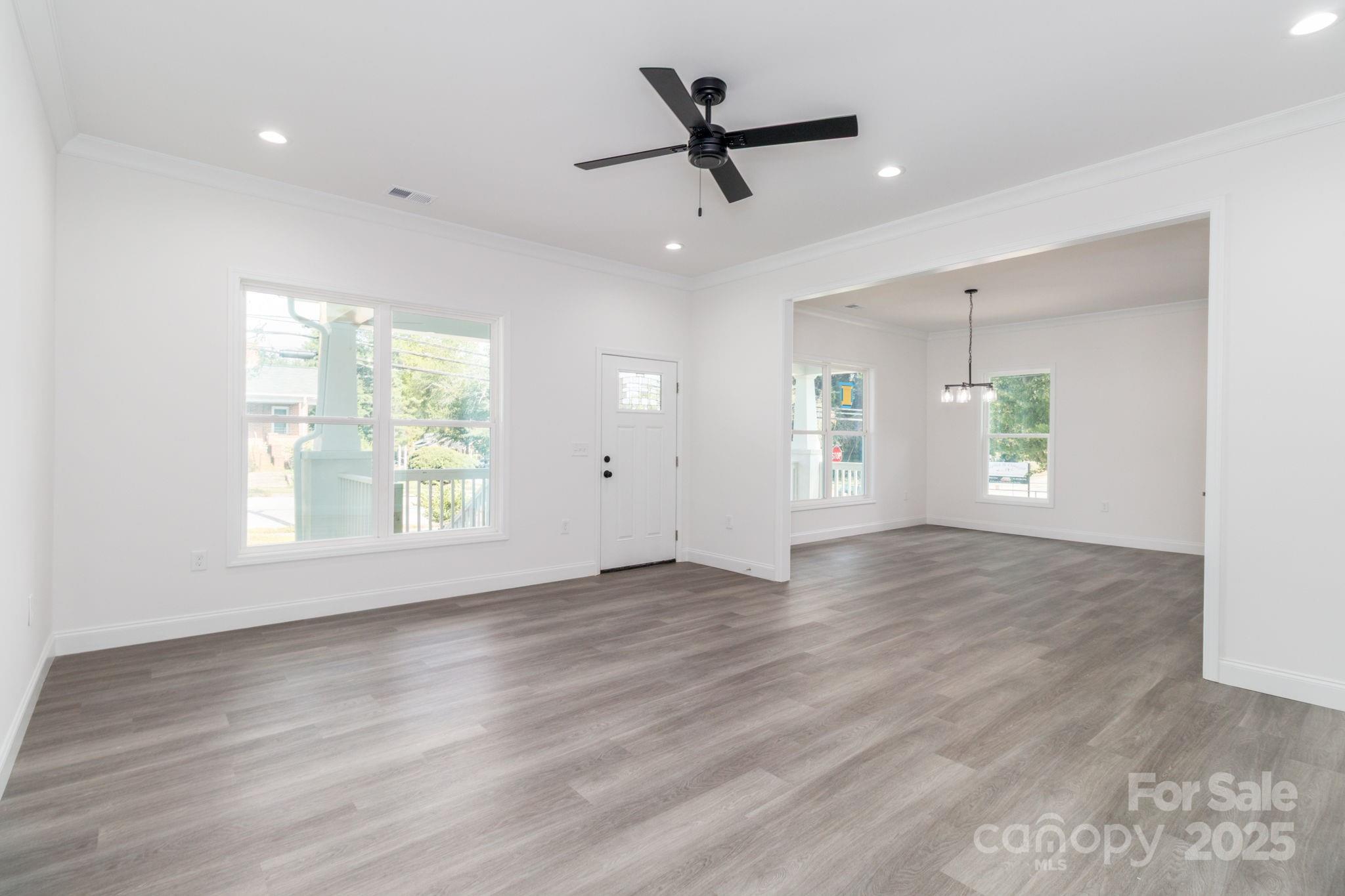 307 East Arch Street Lancaster, SC 29720 - Photo 11 of 43 wooden floor in an empty room with a window