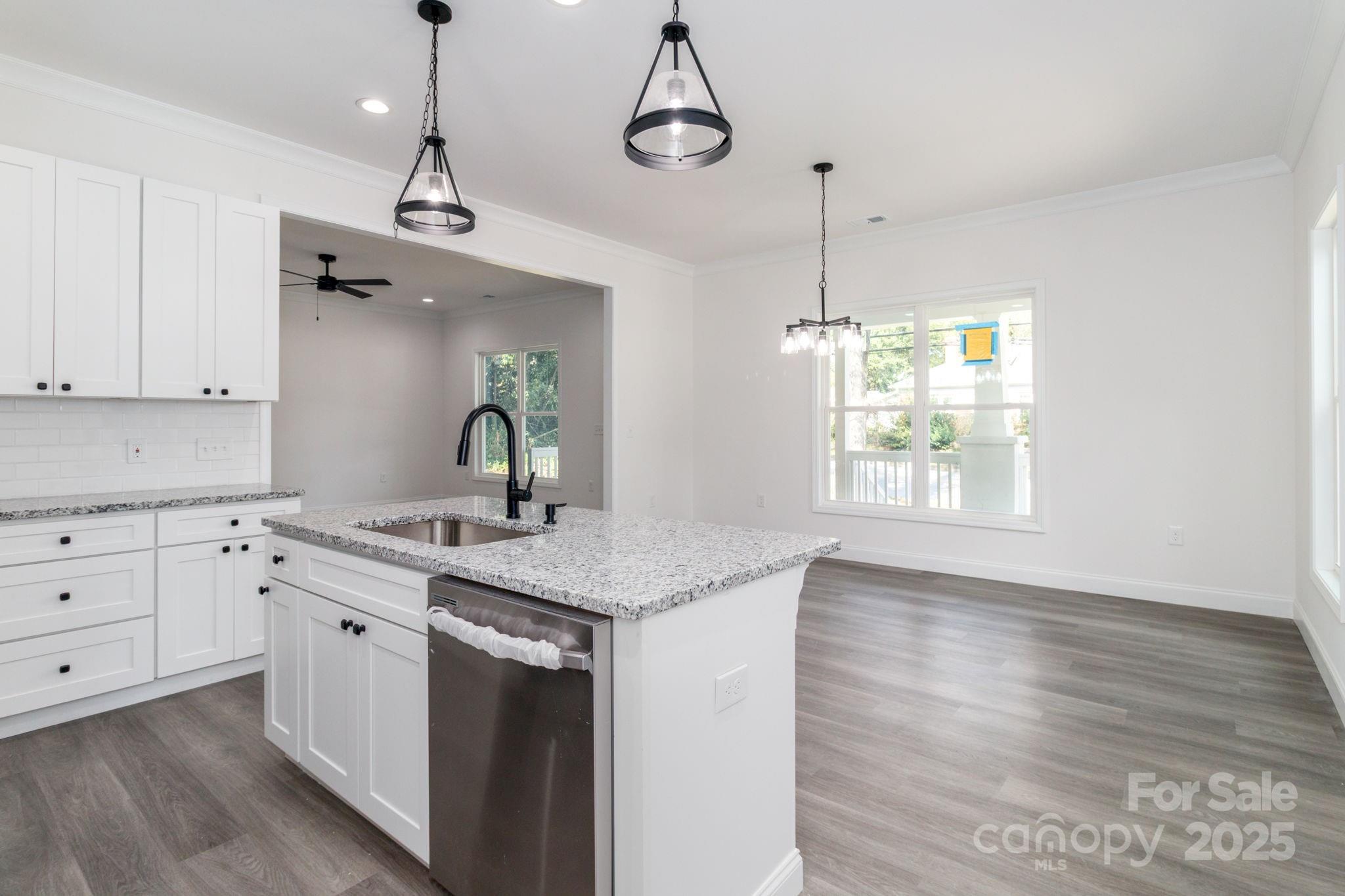 307 East Arch Street Lancaster, SC 29720 - Photo 19 of 43 a kitchen with a sink cabinets and window