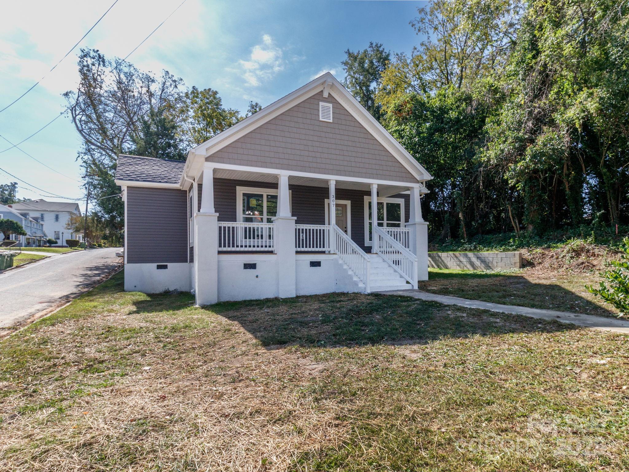 307 East Arch Street Lancaster, SC 29720 - Photo 2 of 43 a front view of a house with a yard