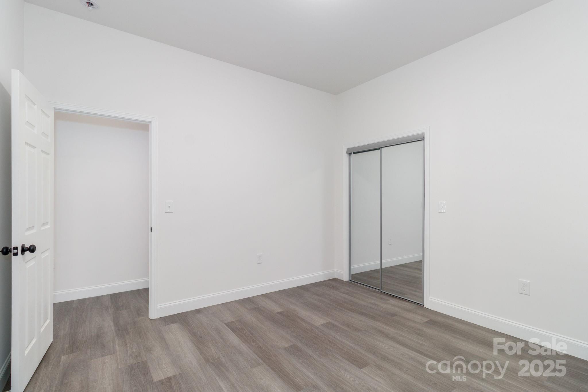 307 East Arch Street Lancaster, SC 29720 - Photo 36 of 43 a view of an empty room with wooden floor and a window