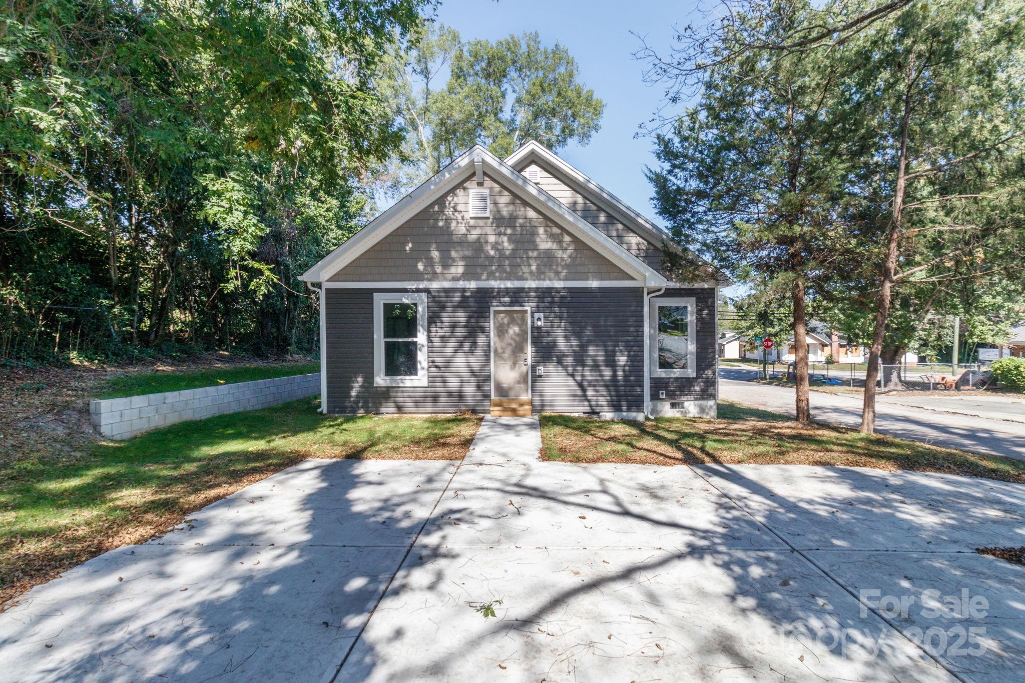 307 East Arch Street Lancaster, SC 29720 - Photo 39 of 43 a view of a house with backyard and trees