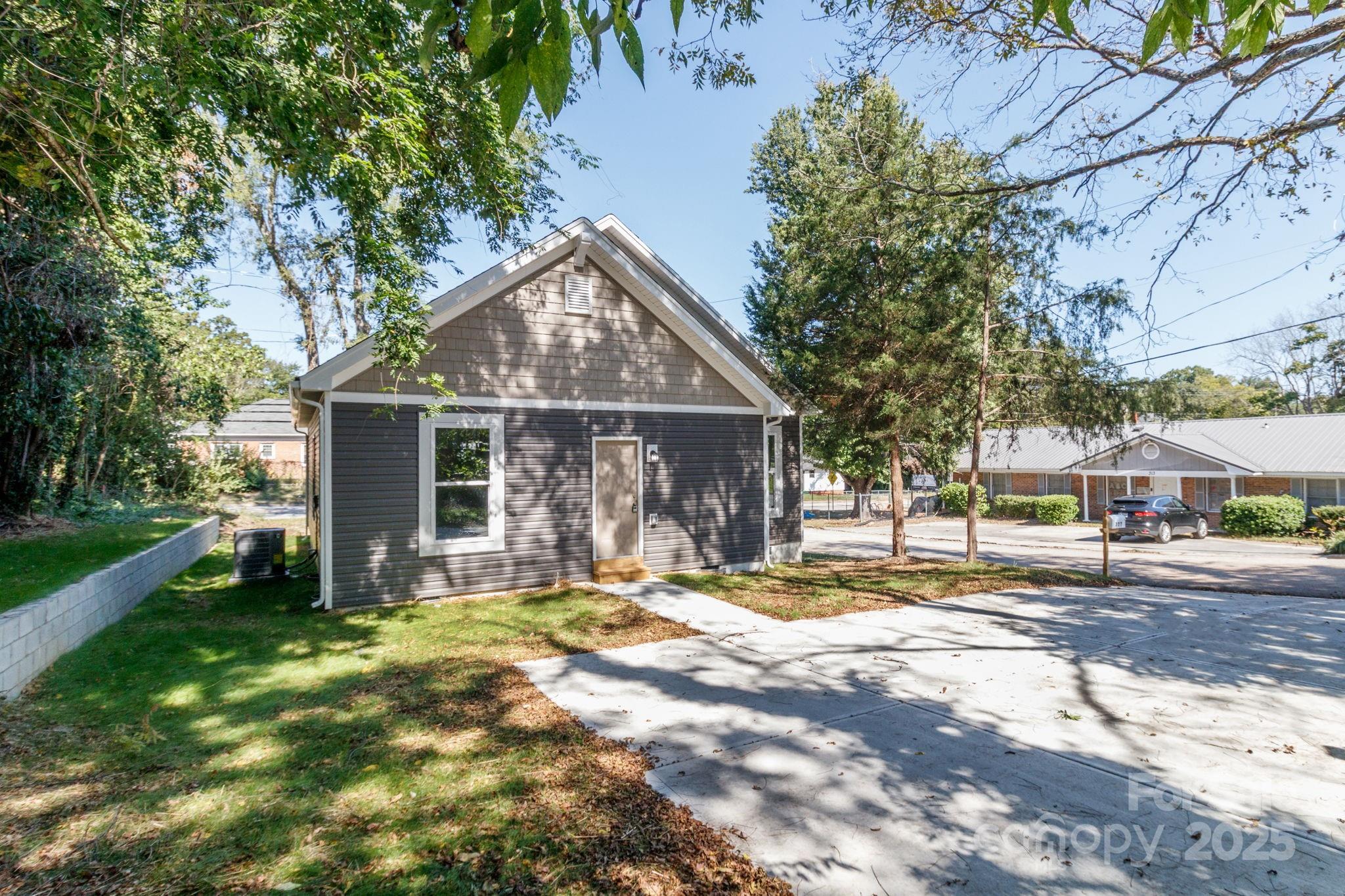 307 East Arch Street Lancaster, SC 29720 - Photo 40 of 43 a view of a house with yard and tree s