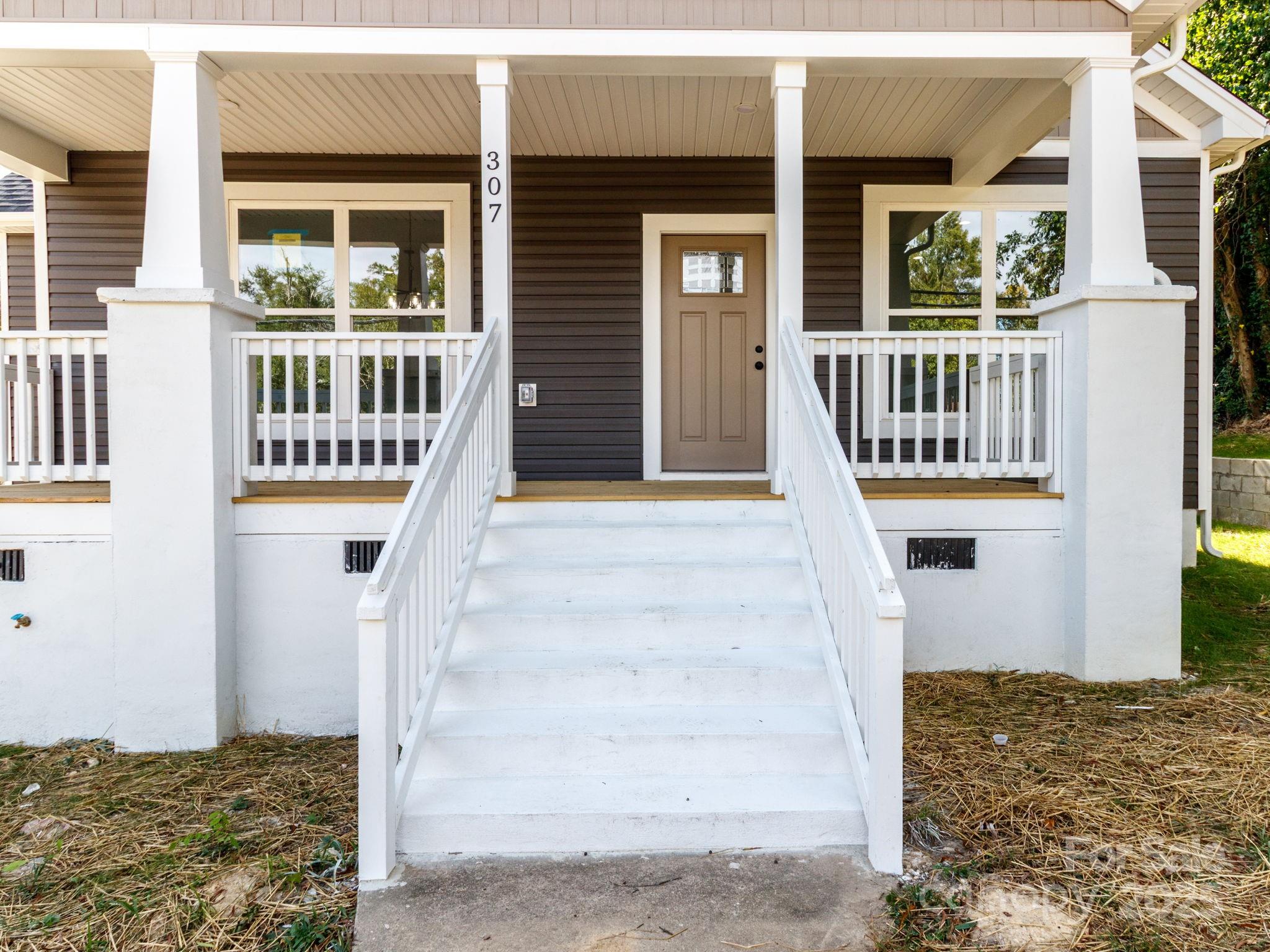 307 East Arch Street Lancaster, SC 29720 - Photo 4 of 43 a front view of a house with a porch