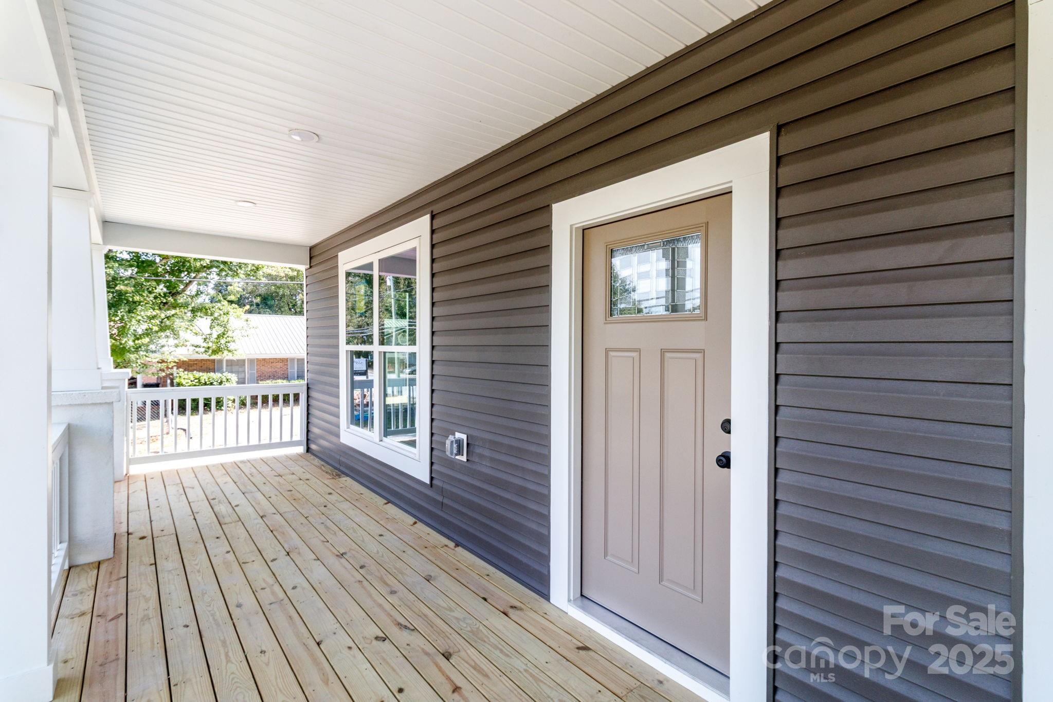 307 East Arch Street Lancaster, SC 29720 - Photo 5 of 43 a view of a balcony with wooden floor