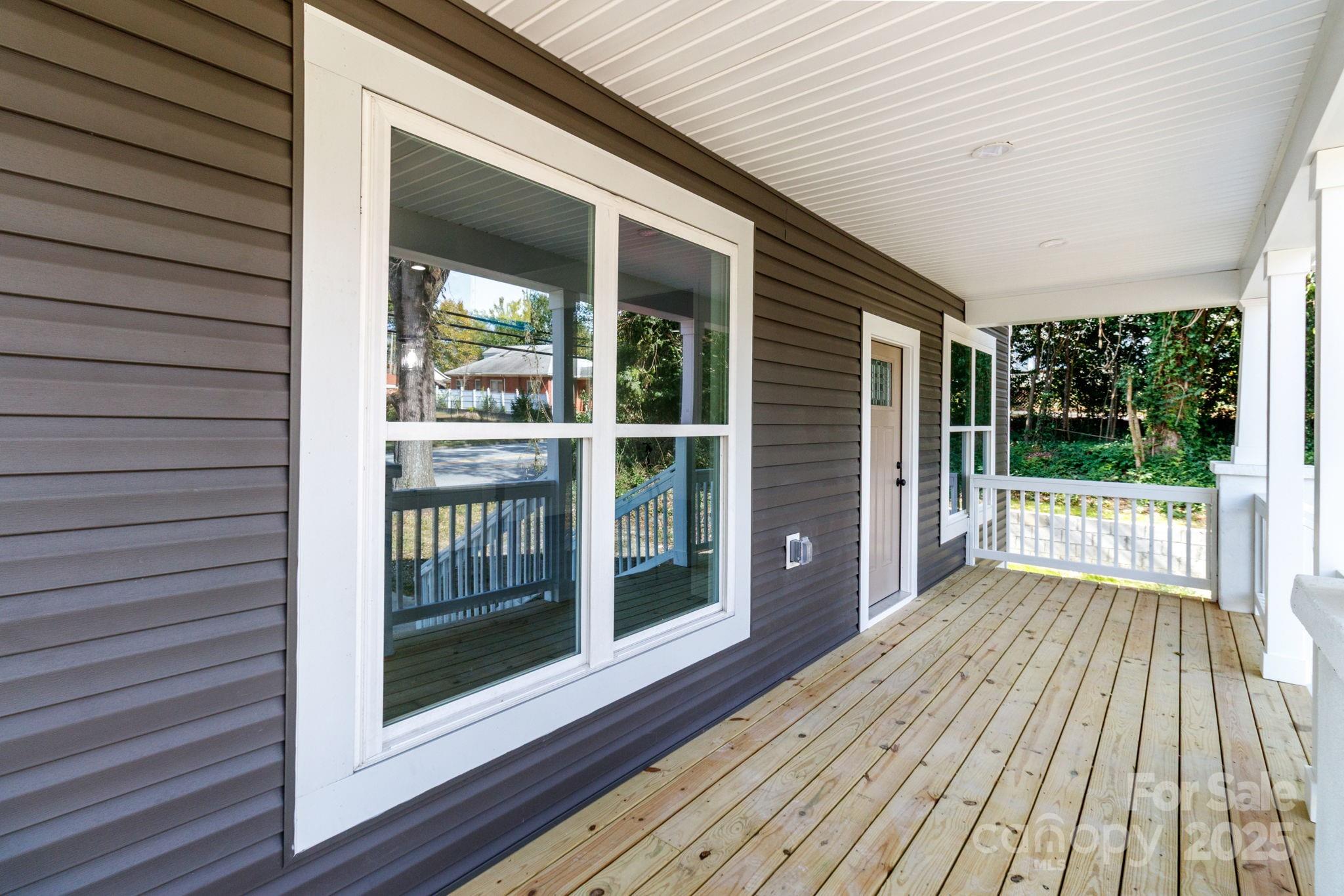 307 East Arch Street Lancaster, SC 29720 - Photo 6 of 43 a view of backyard with large window and wooden floor