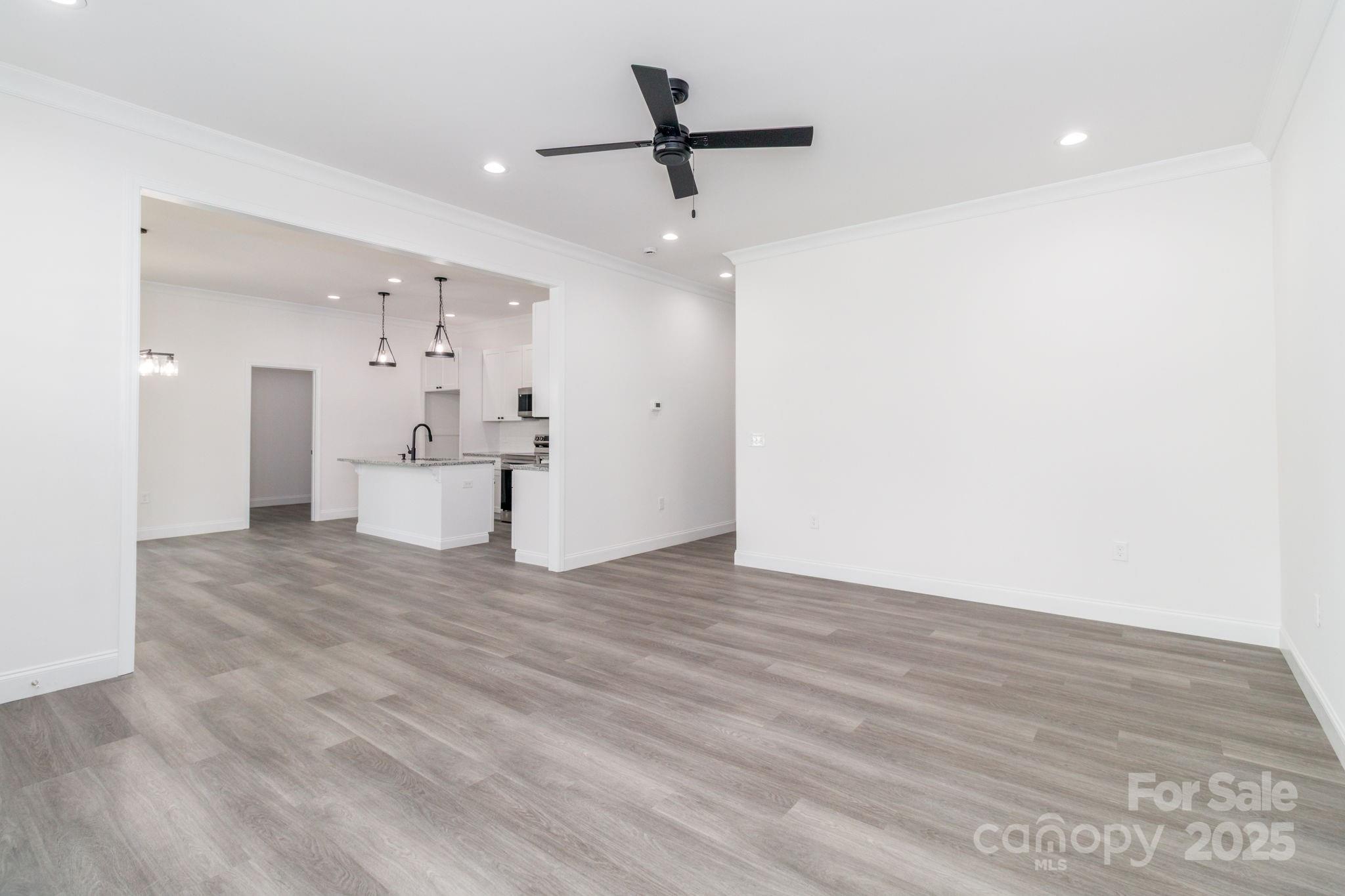 307 East Arch Street Lancaster, SC 29720 - Photo 10 of 43 a view of kitchen with wooden floor and window